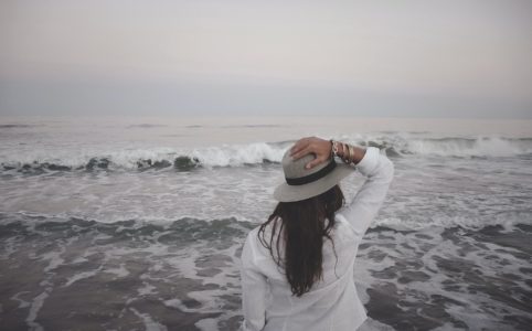 Woman looks at beach