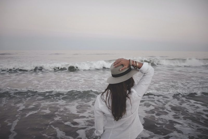 Woman looks at beach